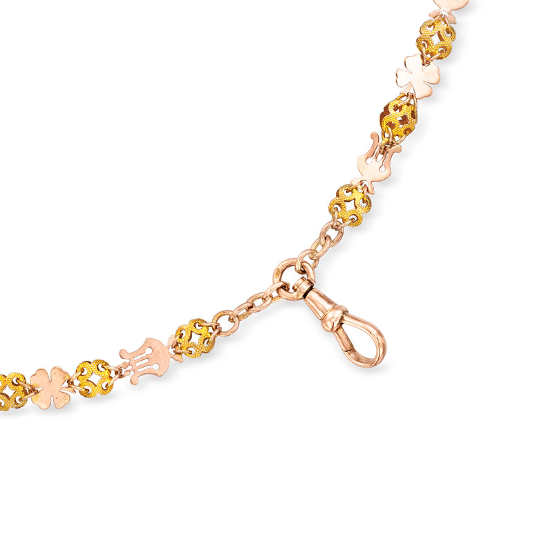 Two-tone gold chain with butterfly links and lobster clasp, simulated seed-pearl accents.