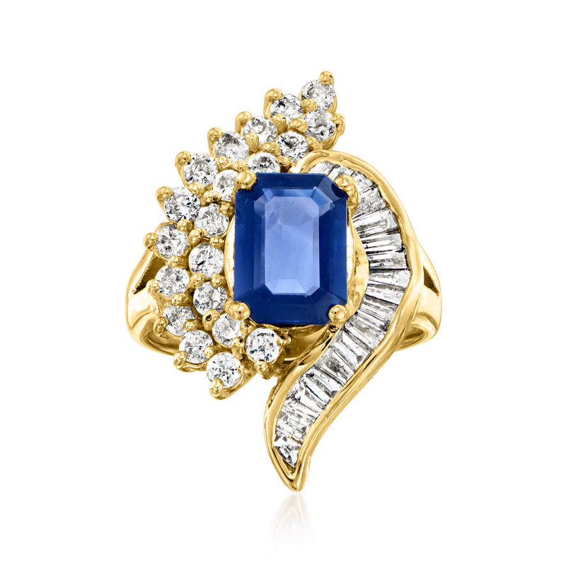 14kt yellow gold cocktail ring with blue sapphire center and diamond swirl accents