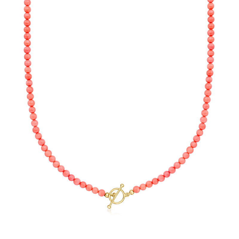 Pink coral bead toggle necklace with gold-tone charms and 18kt gold over sterling toggle