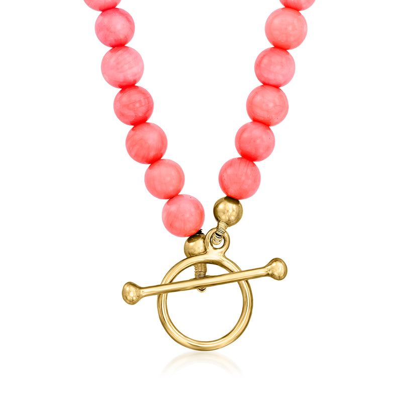 Pink coral bead charm necklace with gold-tone toggle and dangling star charm