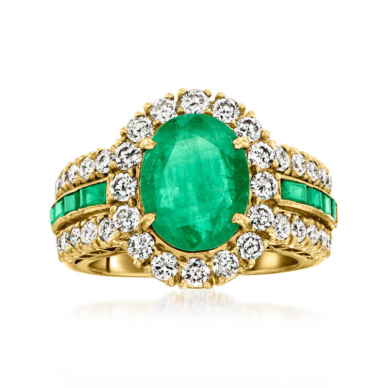 18kt yellow gold oval emerald center with diamond halo and side channel-set emeralds