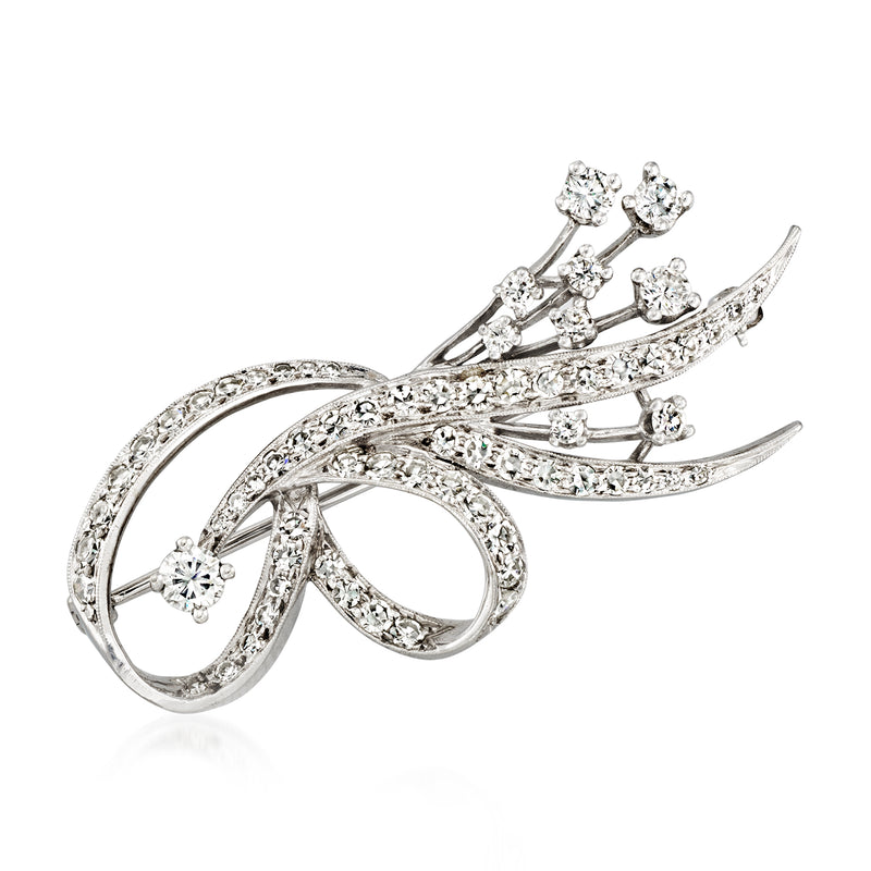 Vintage white gold diamond spray pin with intertwined ribbon design and round stones