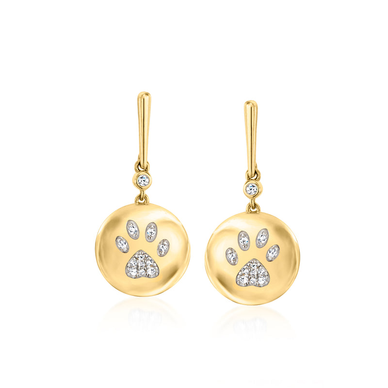 Gold drop earrings with round paw-print charm, small diamond accents