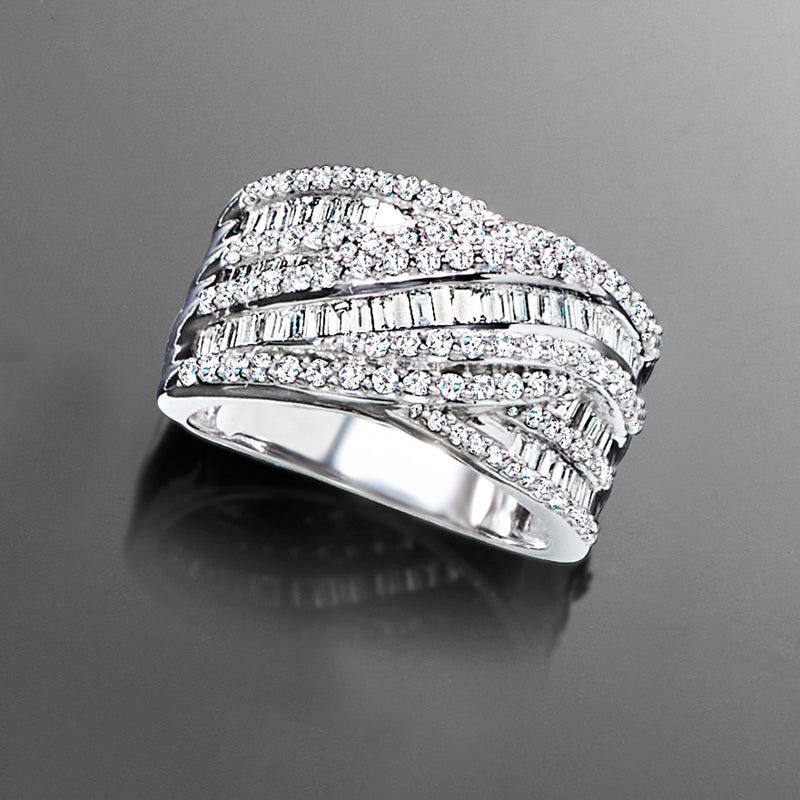 Sterling silver crisscross diamond ring with baguette and round stones, angled view