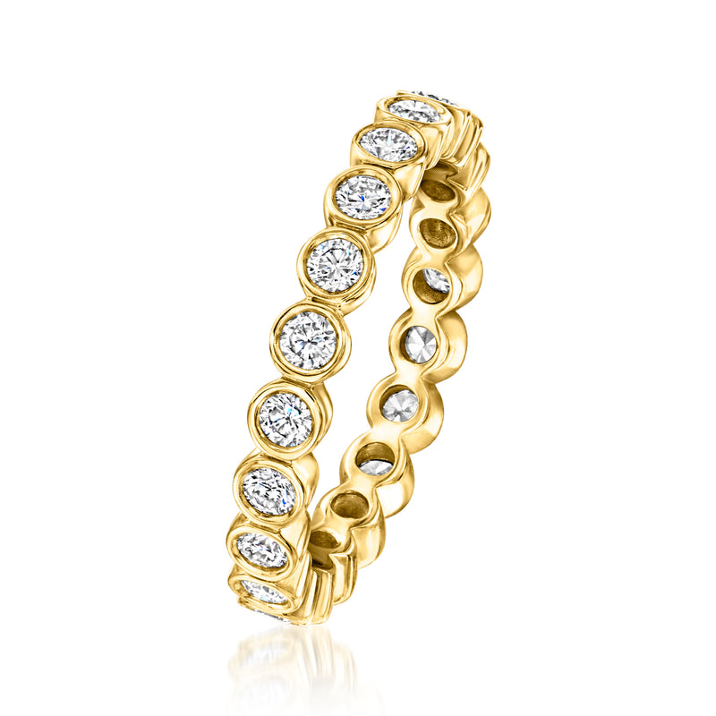 Gold eternity band with round bezel diamonds along curved band, open side view