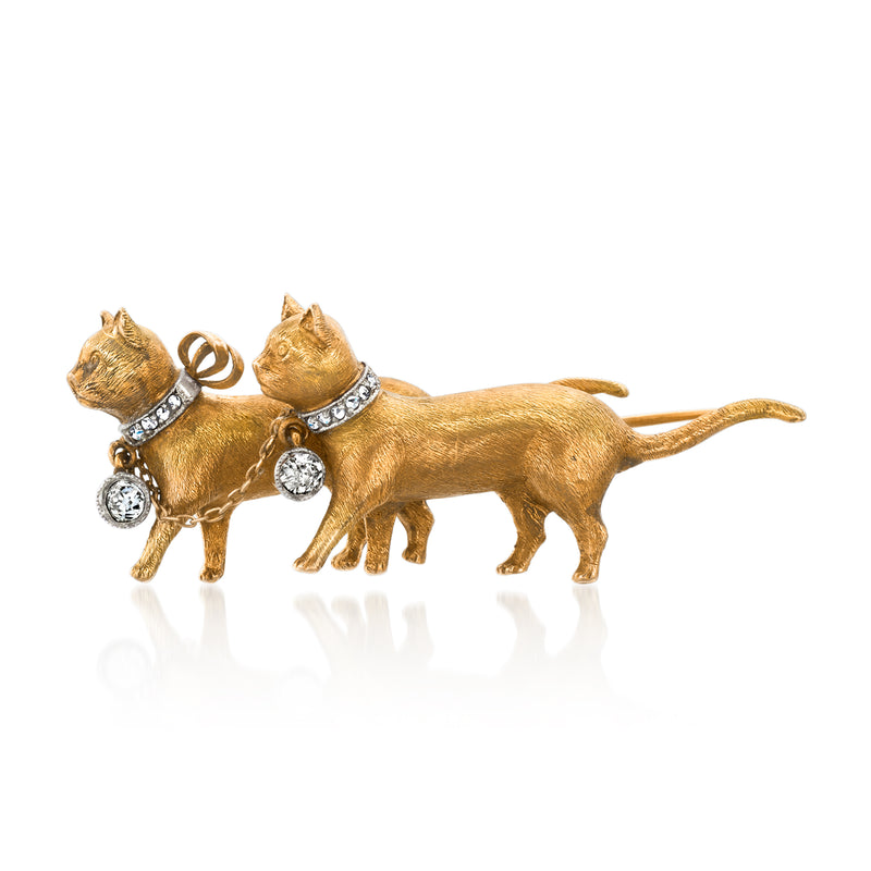 Vintage yellow gold cat pin with two cats and diamond-like accents