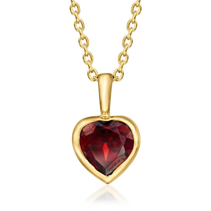 Gold heart pendant necklace with red faceted gemstone
