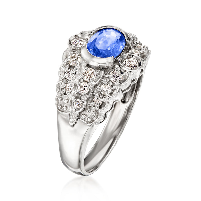 Platinum sapphire and diamond ring with oval blue center stone