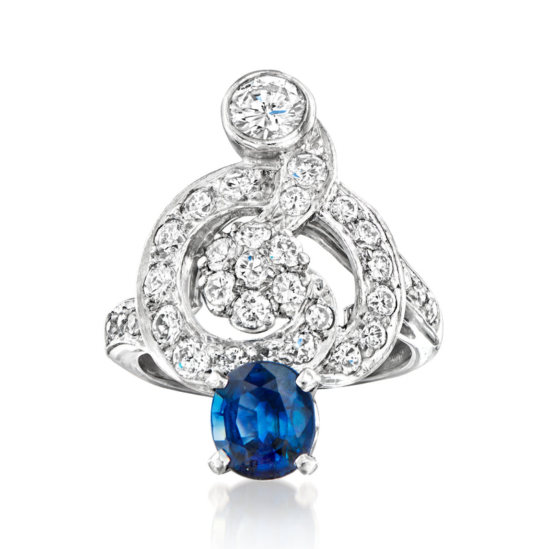 Vintage sapphire and diamond swirl ring with oval blue sapphire and pavé diamonds