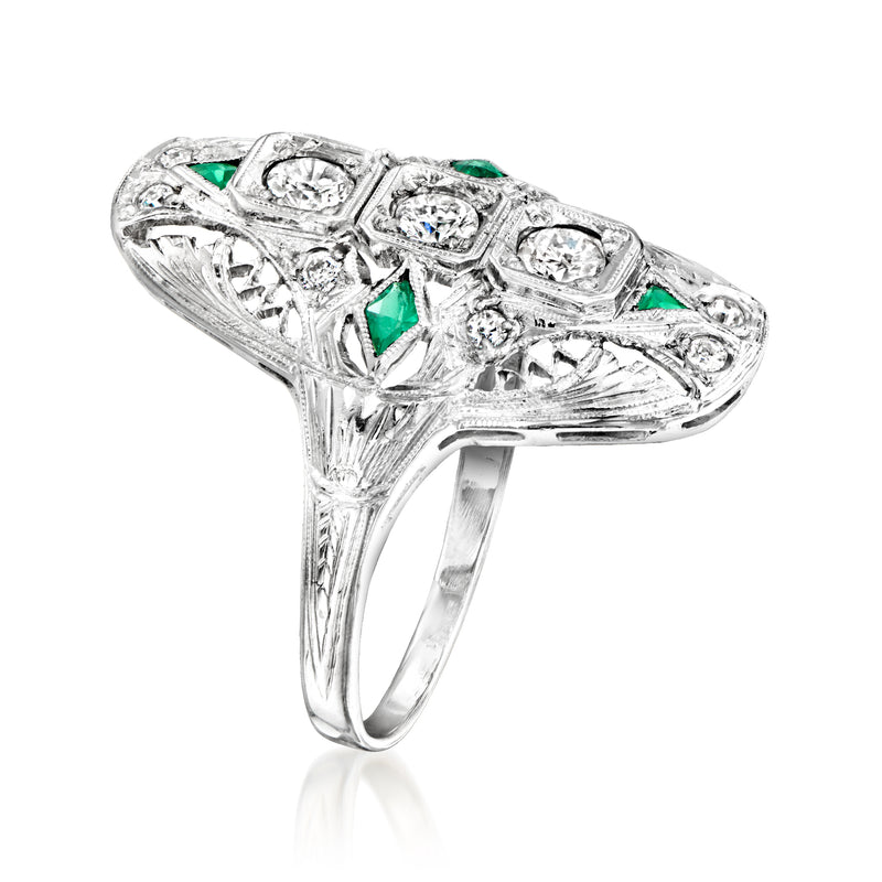 Side view vintage filigree ring with diamond accents and green simulated emeralds