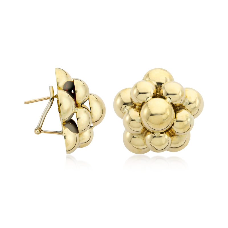 Gold circle cluster earrings with visible post backing and round ball texture