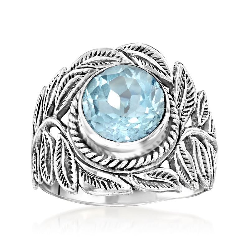 Sterling silver leaf ring with oval sky blue topaz-style gemstone, Bali-inspired setting