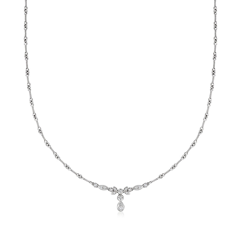 Diamond tennis necklace with small linked stones and teardrop pendant in white gold