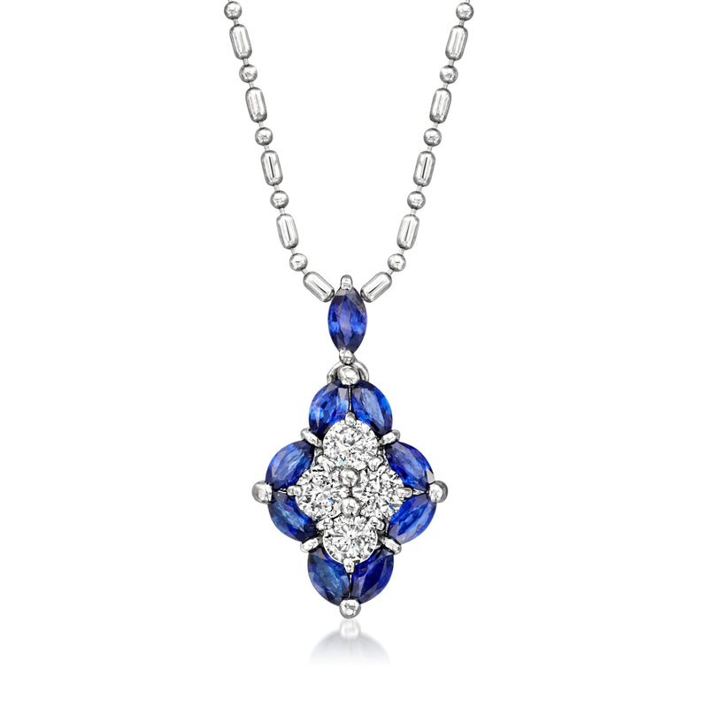 Platinum pendant necklace with blue sapphire pear stones and diamond cluster center