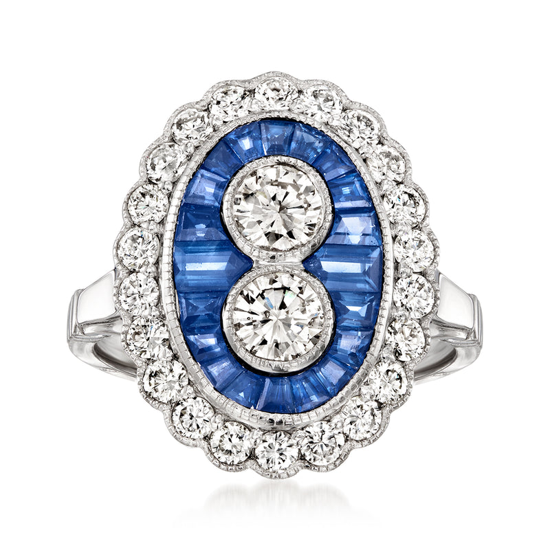 Platinum ring with oval blue sapphire center, diamond halo, two round diamonds