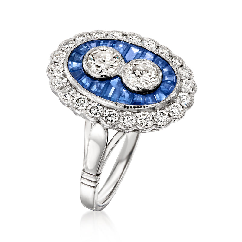 Platinum oval sapphire ring with diamond halo and two round center diamonds