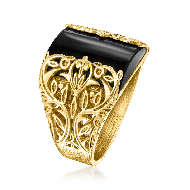 Gold-tone ring with carved floral openwork and black rectangular inset