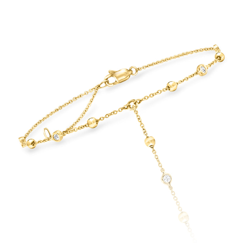 14kt yellow gold beaded hand chain with linked stations and small bezel diamonds