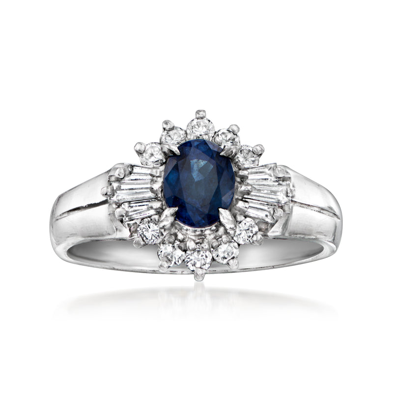 Vintage platinum ring with deep blue sapphire center and diamond cluster halo