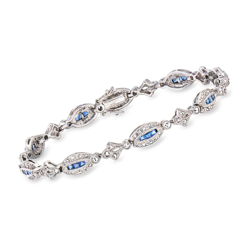 White gold link bracelet with oval blue sapphires and diamond accents, hinged style