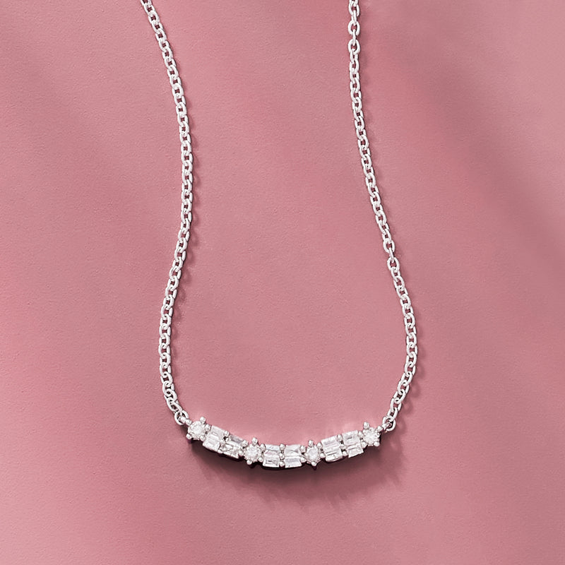 Curved bar sterling silver diamond necklace with round and baguette stone stations