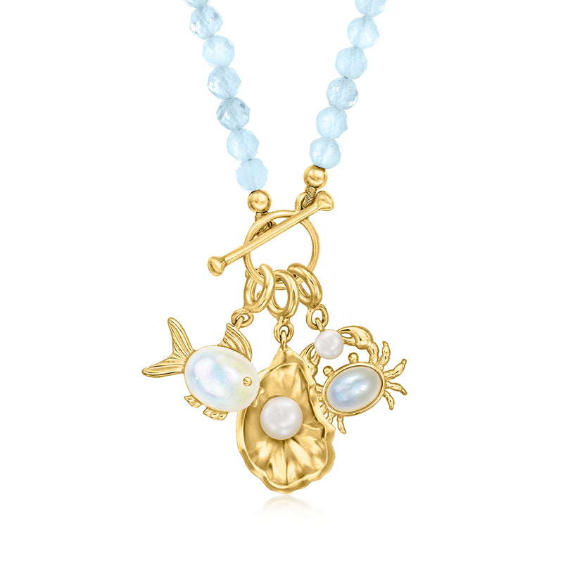 Aquamarine bead charm necklace with gold toggle and floral cluster pendant with pearls.