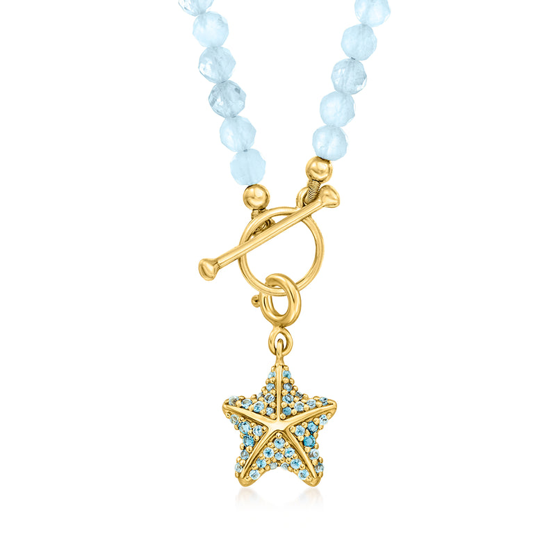 Aquamarine bead charm necklace with gold toggle and blue-stone star charm pendant.
