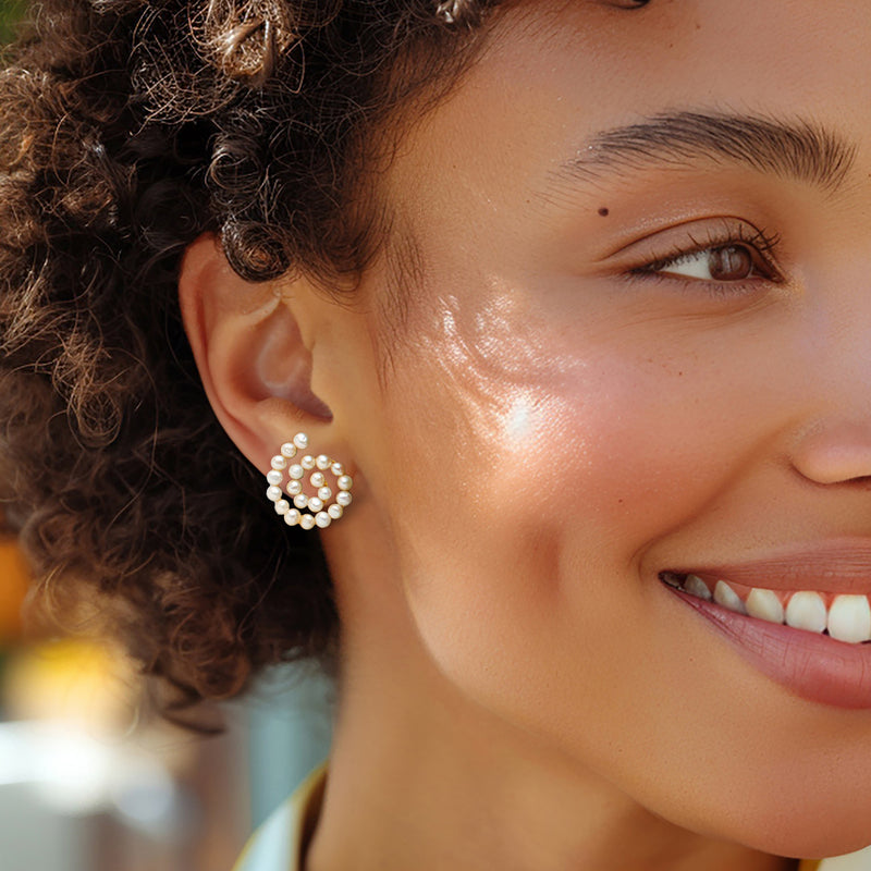 Cultured pearl swirl stud earrings with round bead hoops, small gold-toned posts