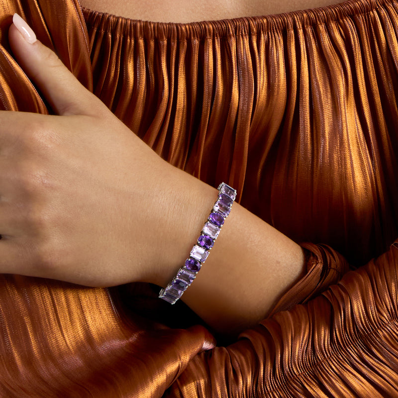 Sterling silver amethyst bracelet on wrist with purple rectangular stone row