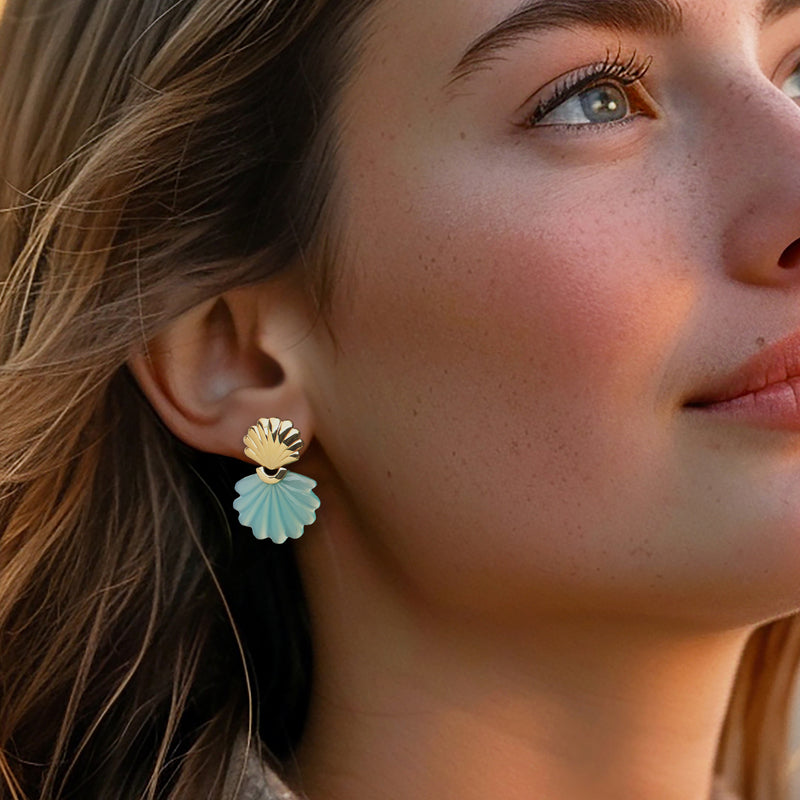 Gold-tone seashell drop earrings with light blue scallop detail