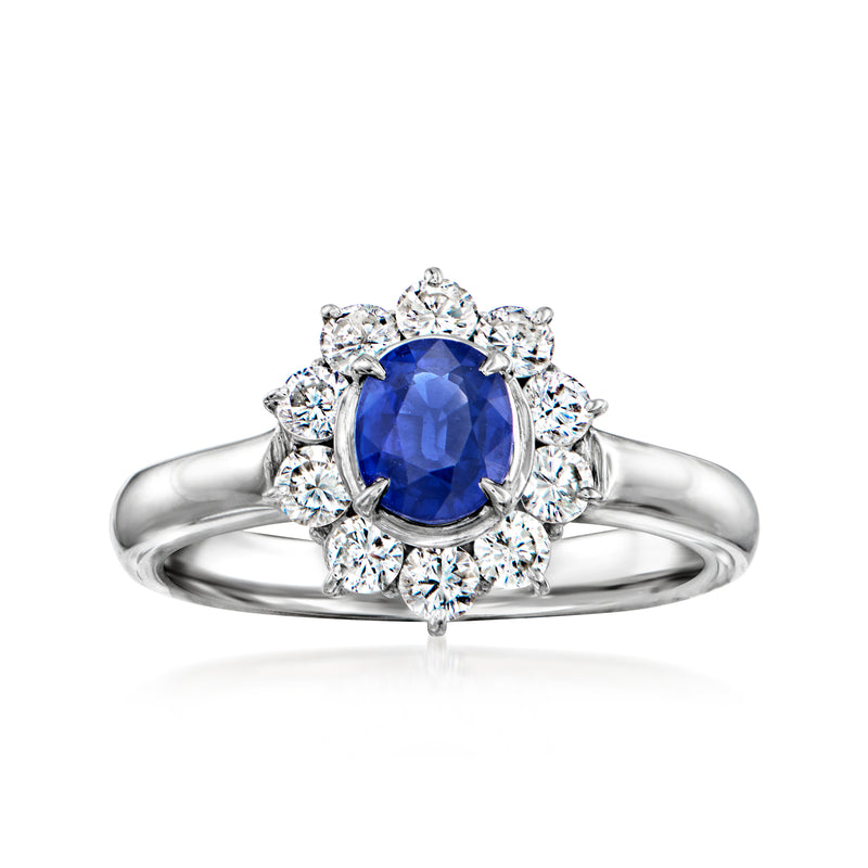 Vintage sapphire and diamond halo ring in platinum, oval blue center stone