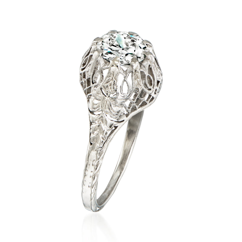 Side view of platinum filigree ring with large round diamond
