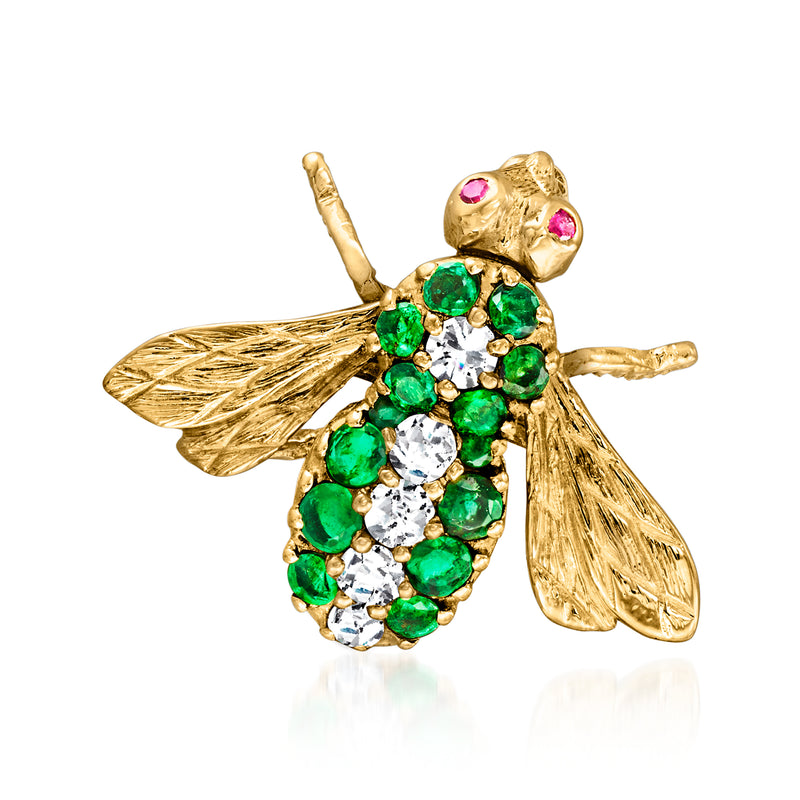 Gold bumblebee pin with green gemstone body, white diamonds, and pink ruby eyes