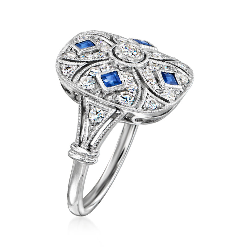 Platinum vintage ring with blue square sapphires, diamond halo and filigree top