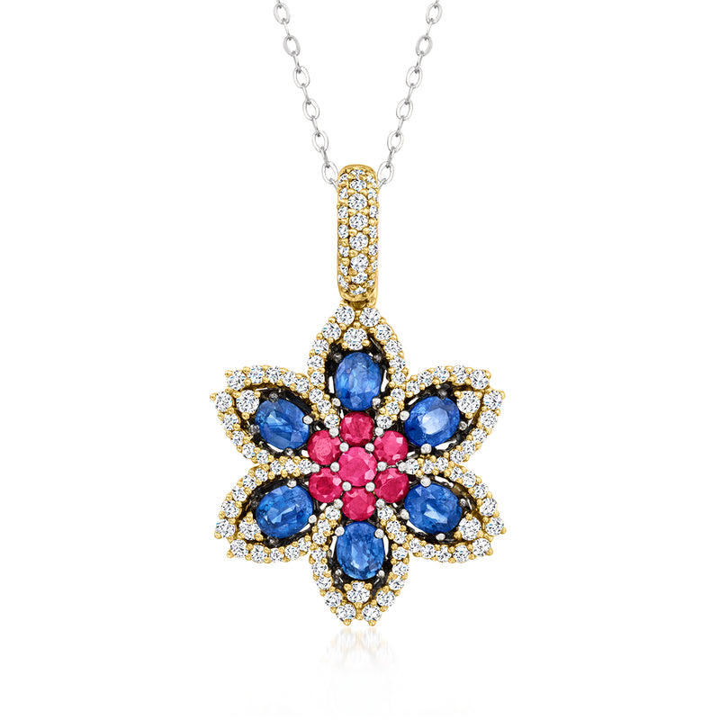 Two-tone gold flower pendant necklace with blue sapphire ovals, ruby center, and diamond halo