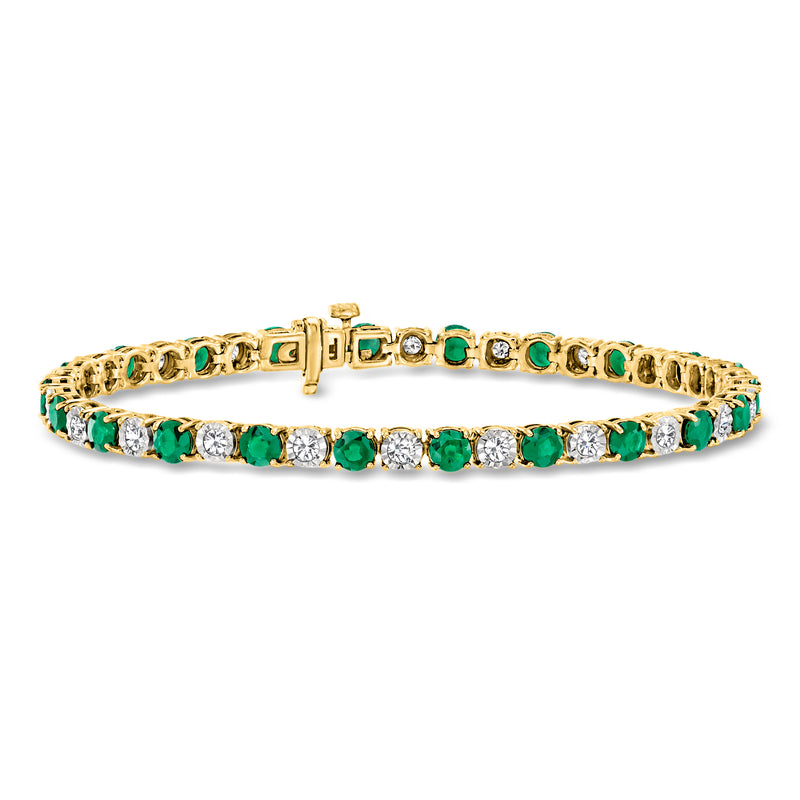 Gold tennis bracelet with emerald-green oval stones and white diamond accents