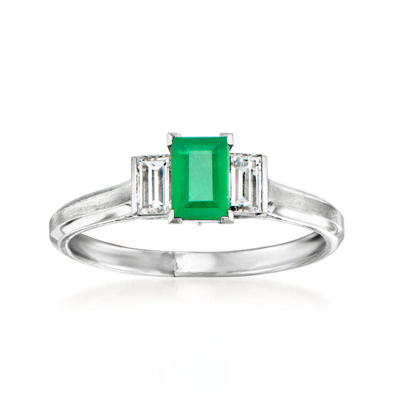 Platinum vintage ring with emerald-cut green gemstone and baguette diamond side stones