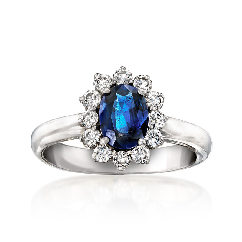 14kt white gold ring with oval blue sapphire and diamond halo cluster