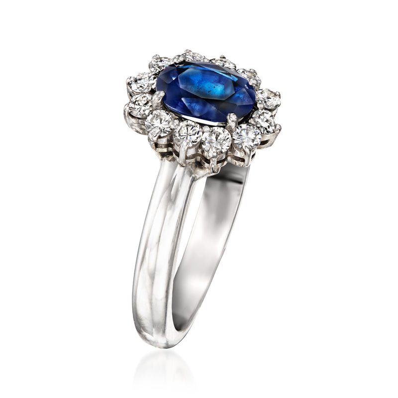 Oval blue sapphire ring in 14kt white gold with diamond halo, side view