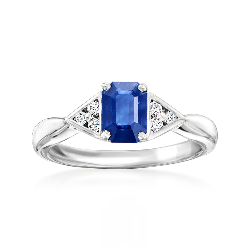 Platinum ring with emerald-cut blue sapphire center and diamond side accents