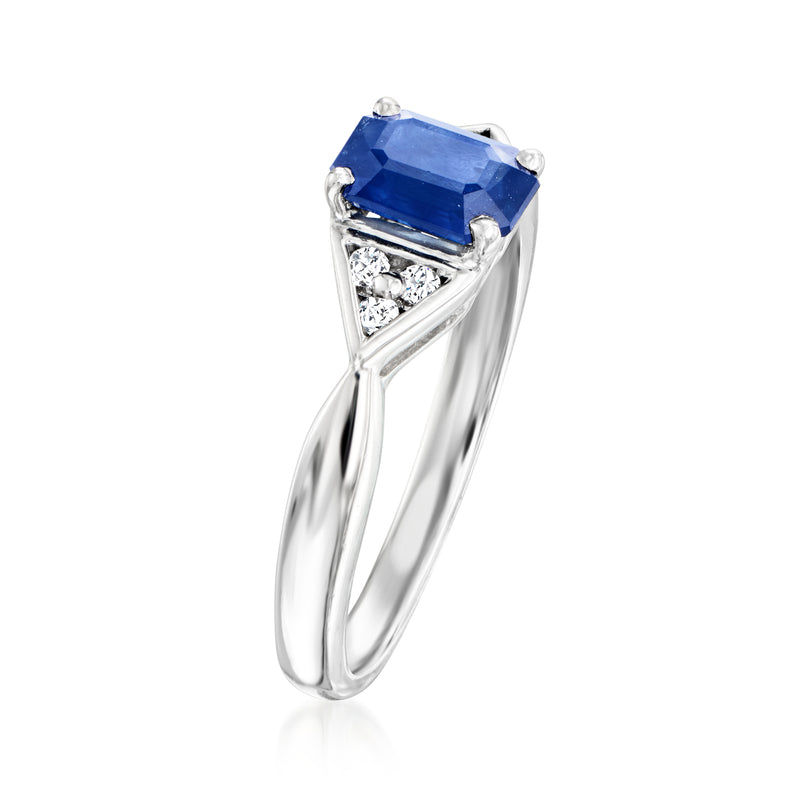 Platinum sapphire ring with rectangular blue stone and triangular diamond detail
