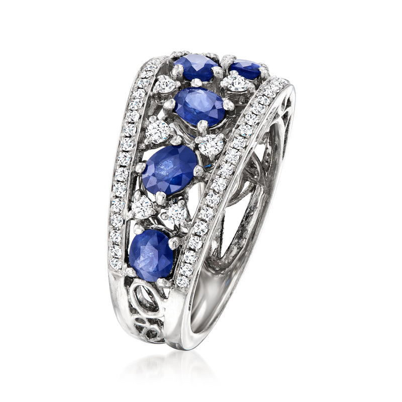Side view of 18k white gold openwork ring with blue sapphires and diamond halo