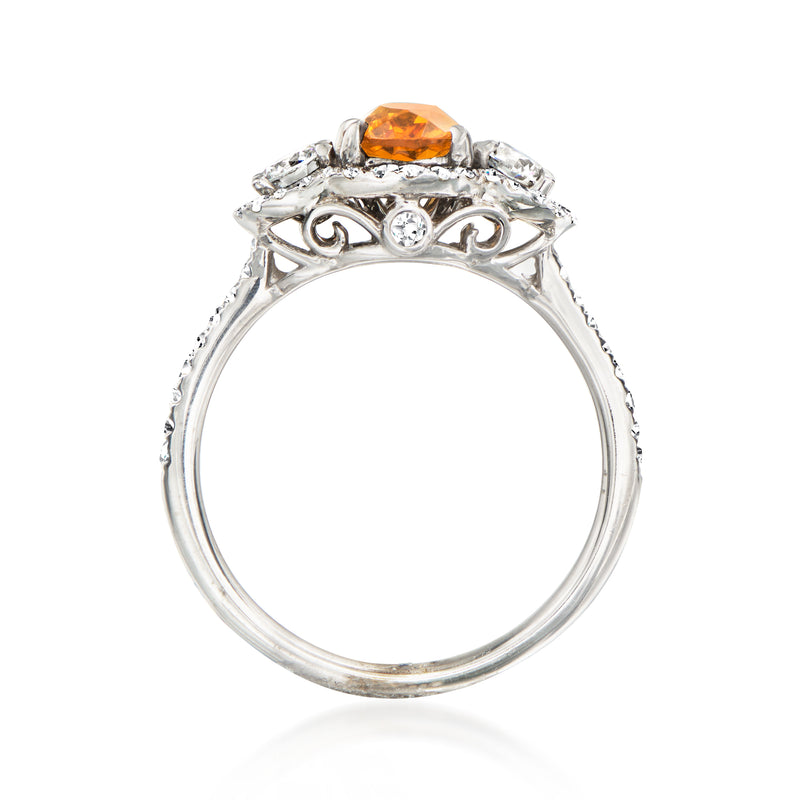 White gold ring with orange citrine oval and decorative diamond filigree shoulders