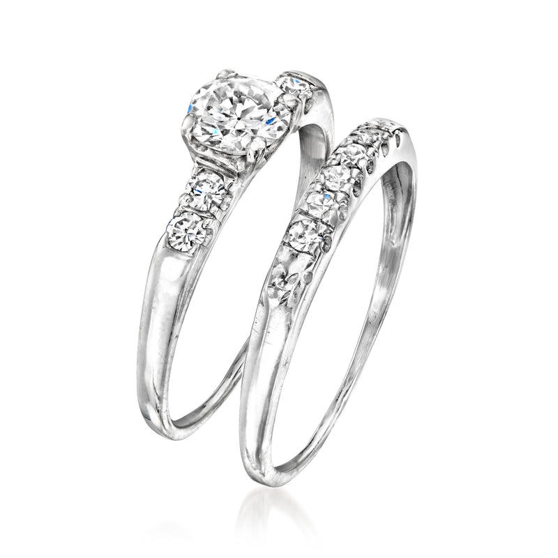 Vintage diamond bridal set with round center stone and matching band in silver-tone metal