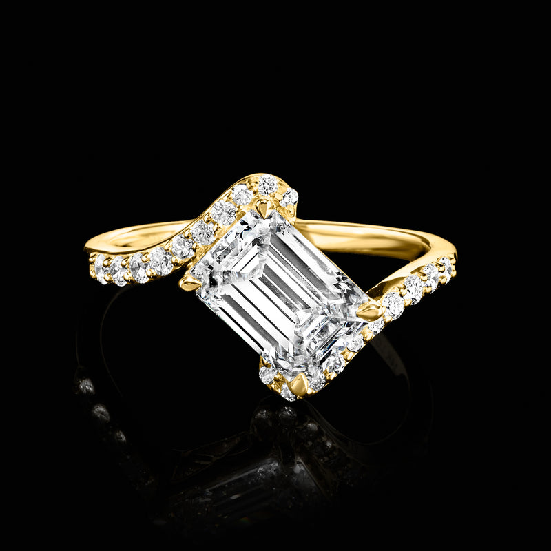 14kt yellow gold tilted ring with emerald-cut lab-grown diamond and pavé side stones