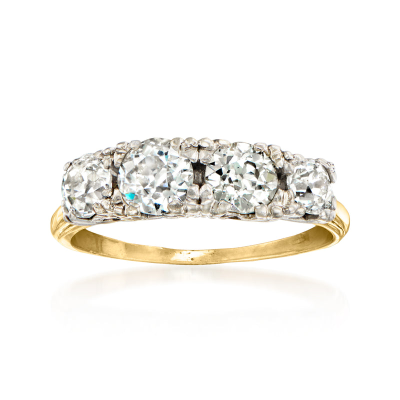Two-tone gold diamond four-stone ring with round stones in a bright band