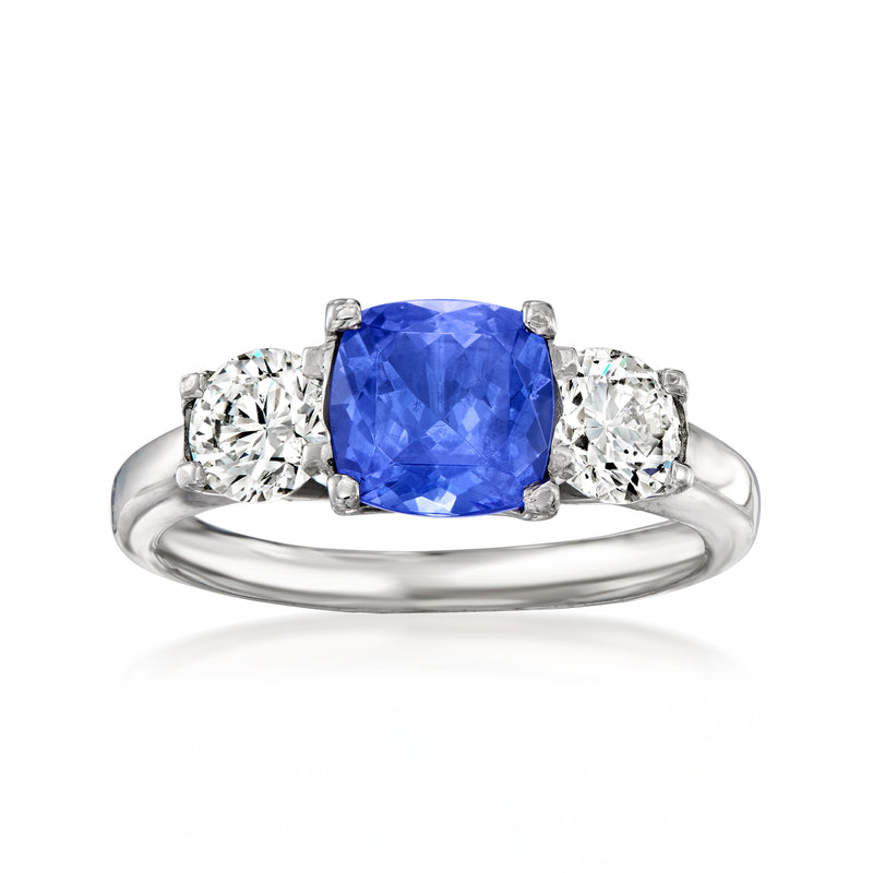 Cushion-cut blue tanzanite and diamond three-stone ring in 18kt white gold