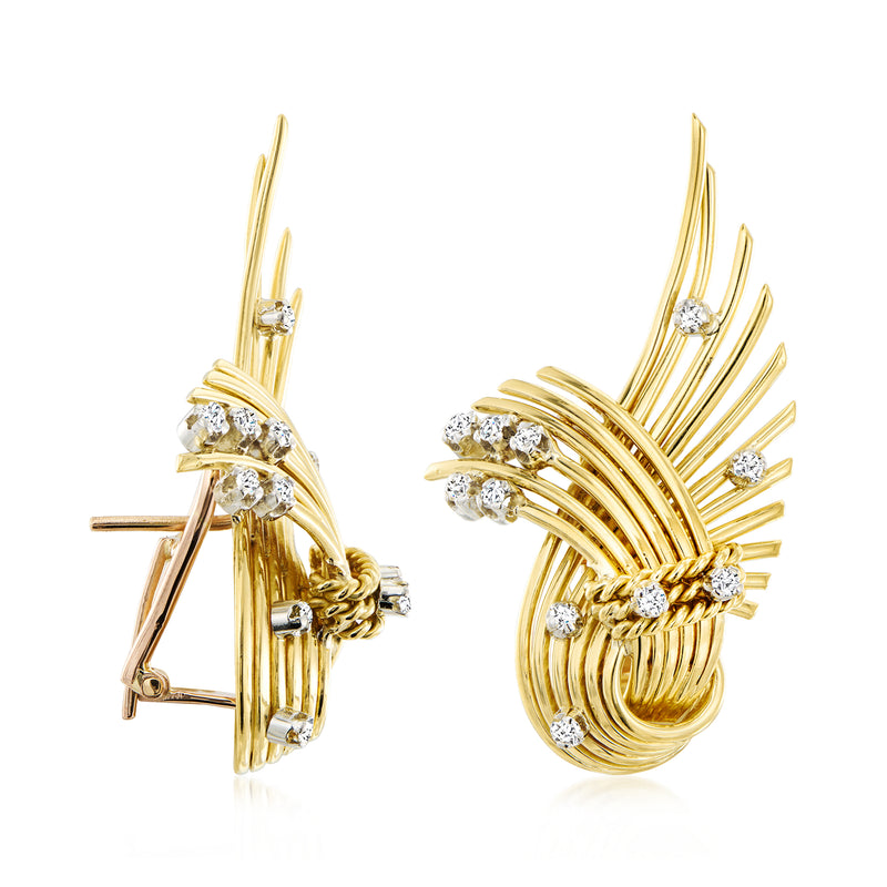 Yellow gold swirl earrings with diamond accents and clip/post backing, side view