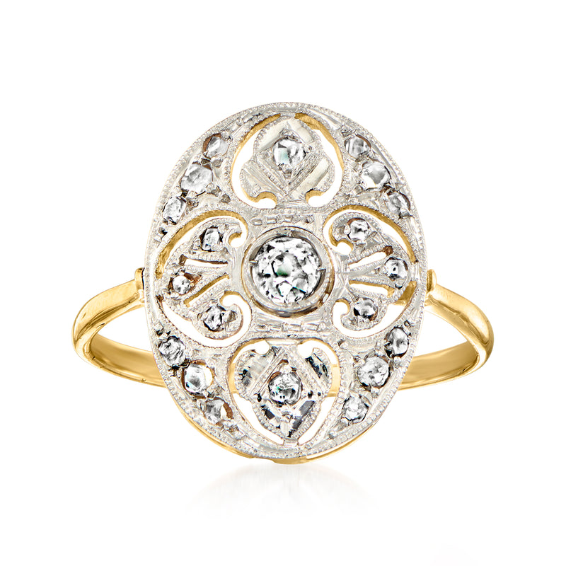 Vintage oval filigree diamond ring in two-tone gold with ornate round stone settings