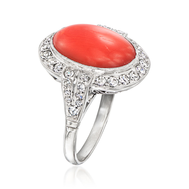 Vintage red coral oval ring with side diamond accents and platinum setting